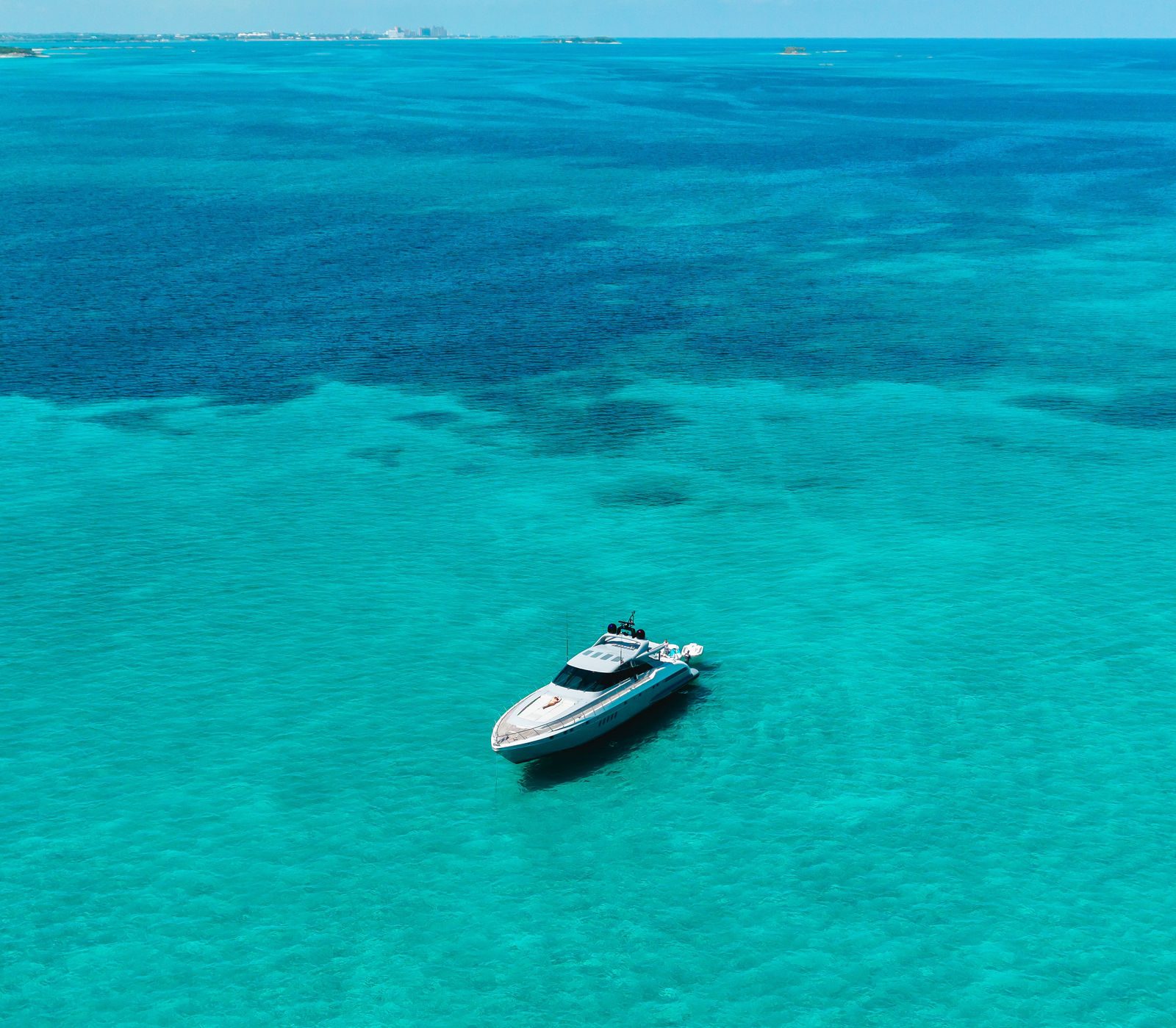 KayDee Mangusta 80 cruising turquoise water Bahamas charter