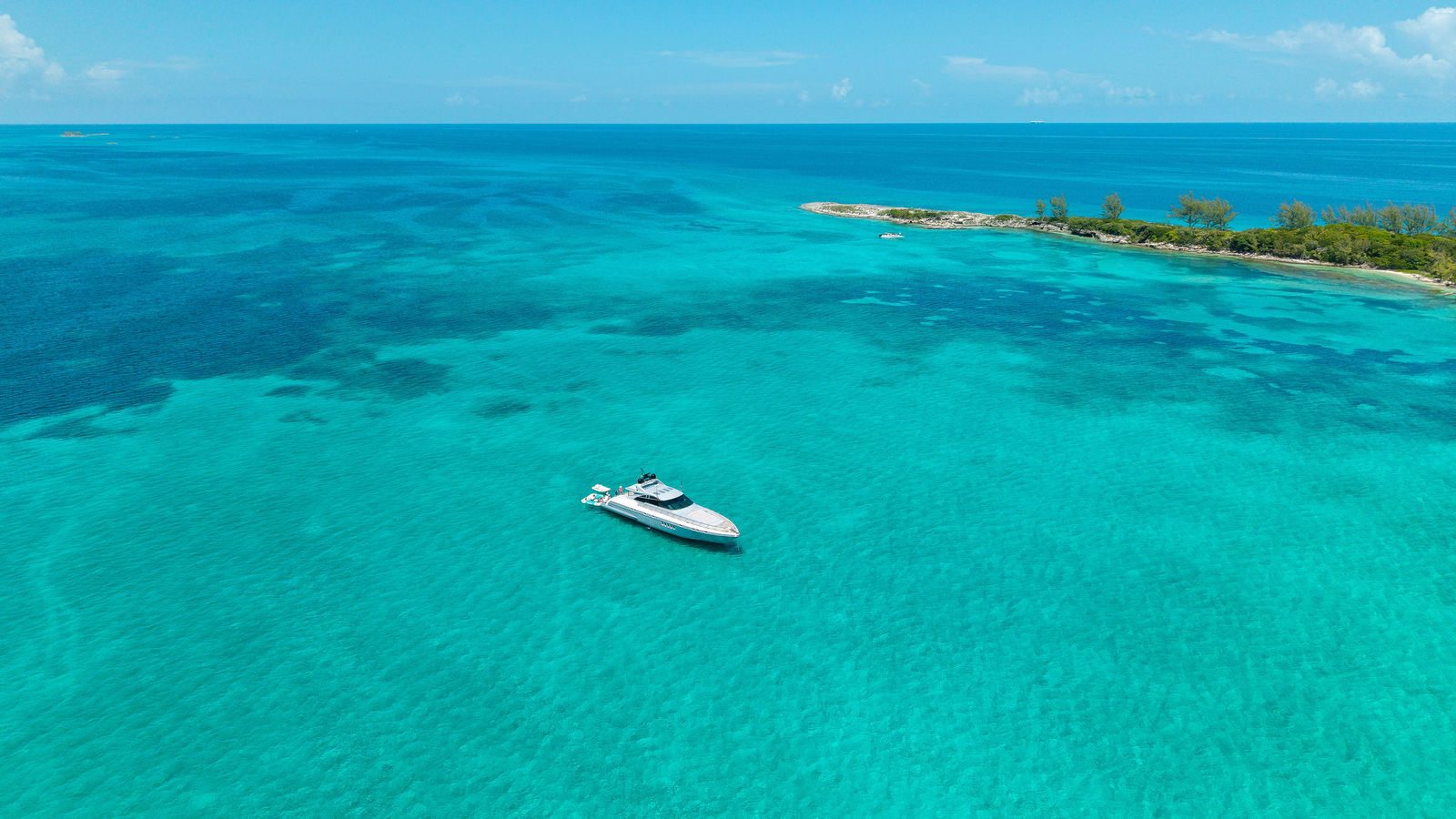 KayDee yacht near a Bahamas island aerial private charter