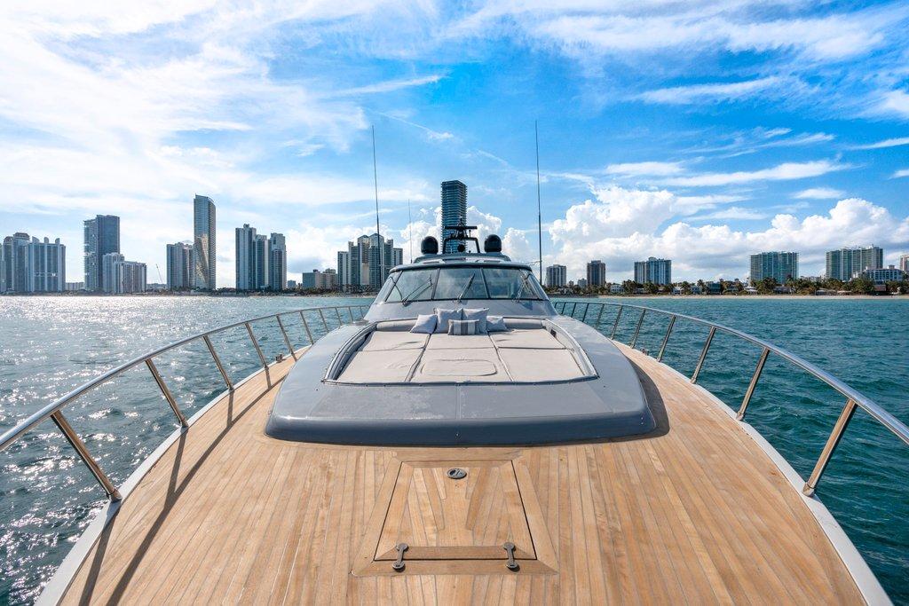 KayDee Mangusta 80 bow deck sunpad yacht charter Nassau skyline