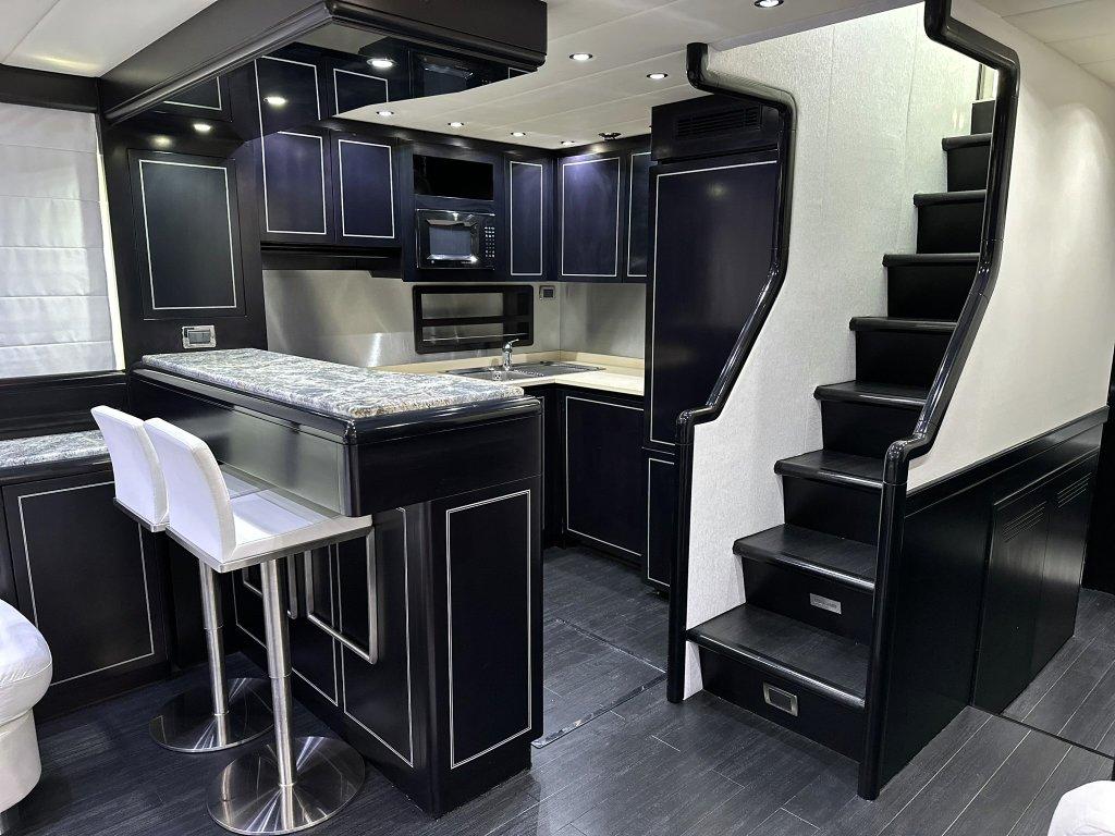 KayDee Mangusta 80 galley kitchen bar dark cabinetry yacht charter