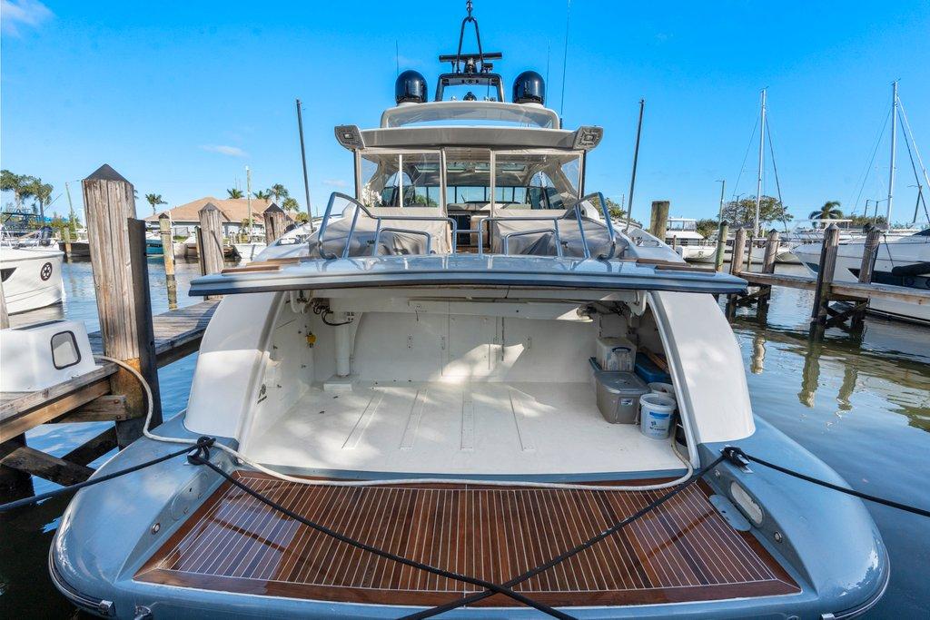 KayDee Mangusta 80 stern view at dock teak platform yacht charter