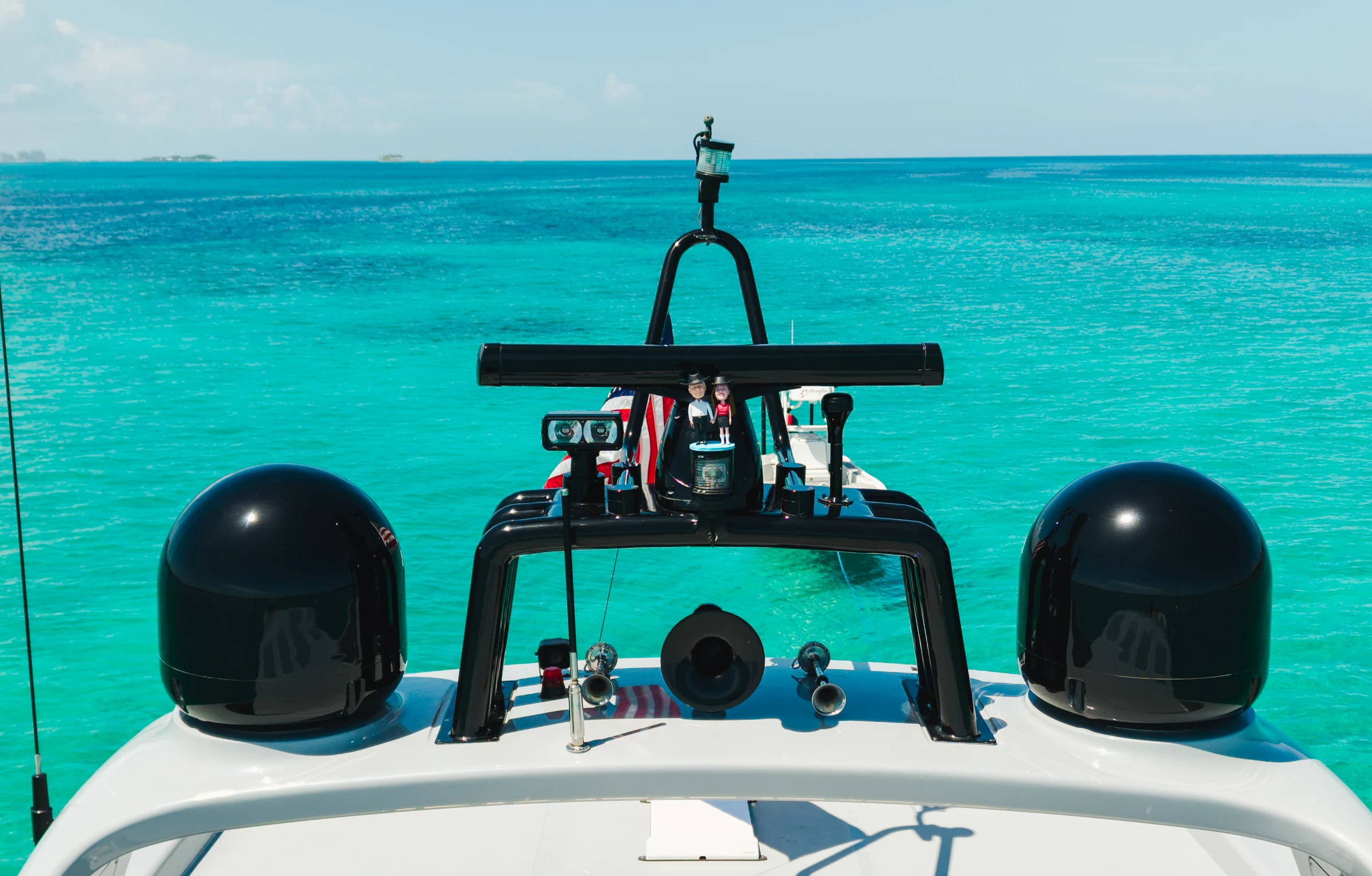 View over KayDee yacht radar arch toward turquoise Bahamas water